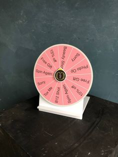 a wheel of fortune sitting on top of a table