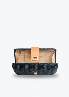 Versatile and chic, the Lou clutch can be dressed up or down, making it the perfect addition to any outfit in your wardrobe. Whether you're heading to a formal event or keeping it casual, Lou is the perfect choice! Handcrafted from all-natural woven rattan using a time-honored Filipino basketweaving technique. Features a gold toned turn lock closure and optional drop-in chain strap. Measures 8.5” W x 5” H x 1.75” D. Chic Clutch Box Bag, Black Clutch With Fold Over Clasp For Evening, Black Evening Clutch With Fold Over Clasp, Black Clutch With Detachable Strap For Formal Events, Elegant Black Clutch With Magnetic Closure, Chic Rectangular Clutch For Everyday Use, Spring Formal Clutch Pouch, Chic Everyday Rectangular Clutch, Chic Black Clutch For Formal Occasions