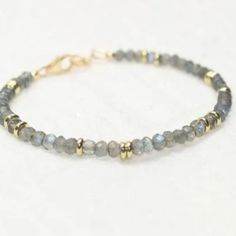 New Gorgeous!! Labradorite Blue Flash Brass Beading Bracelet. Bracelet Has An Extension On The Clasp. Bracelet Is Very Shiny With Blue Flashes Throughout. Perfect For Yourself Or As A Gift. Very Unique And Different. Perfect For Layering. Suitable For All Occasions. Suitable For Most Ages. Nwt Labradorite Bracelets With Faceted Round Beads, Adjustable Labradorite Beaded Bracelets, Adjustable Beaded Labradorite Bracelets, Gold Labradorite Beaded Bracelet, Bohemian Labradorite Gemstone Beaded Bracelets, Gold Beaded Labradorite Bracelets, Gold Beaded Labradorite Bracelet, Bohemian Labradorite Beaded Bracelets With Gemstone Beads, Blue Labradorite Bracelets With Round Beads