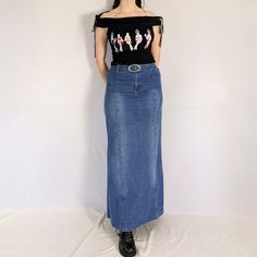 Vintage denim maxi skirt Iconic medium wash denim maxi skirt. Has stonewashing down the front & back thighs. Has a zigzag stitch detail with little rhinestones going down the thighs. The hem flares out a bit. Comes with a denim belt. Has a high waisted fit. The denim has some stretch to it. Made in the early 2000s by Biy Earling Co.  Perfect condition Full measurements are provided Measurements taken flat Tag size: 32 (medium) Waist: 32" (can be tightened w the belt) Hip: 38" - 40" Length: 39.5" Maxi Skirt Y2k, Maxi Rock, Rhinestone Denim, Skirt Y2k, Denim Belt, Jean Vintage, Denim Maxi, Denim Maxi Skirt, Jeans Rock