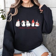 Meowy Christmas Sweatshirt, Happy Cat Year Shirt, Funny Christmas Cat Shirt, Cat Christmas Sweatshirt, Cats Sweat, Cat Lover Christmas Shirt 🧥 **Welcome to EnchantGiftStore 🧥 **Product Overview Our sweatshirts combine style, warmth, and durability. Featuring high-quality materials from **Bella Canvas** and **Gildan each piece is meticulously made to ensure comfort and long-lasting wear. - Unisex sizing for a perfect fit. - A cozy blend of 50% cotton and 50% polyester. - Double-needle stitching for extra strength. Our designs are printed using **DTF (Direct to Film technology, offering rich colors and a durable finish that stands the test of time. **How to Order 📸 Browse the product photos for detailed views. 🎨 Select your preferred size and color. ✍️ Add any customization with your tex Cat Years, Meowy Christmas, Cat Christmas, Christmas Cat, Custom Sweatshirts, Cat Shirt, Happy Cat, Rich Colors, Cat Shirts