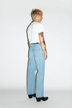 A classic pair of straight-leg jeans inspired by the off-duty uniform of 90's runway models. Designed to pinch just above the hips, the high-rise and roomy straight-leg elongates the leg for a rugged, boyish cut. Constructed in a rigid, non-stretch denim, these go-to jeans only gets better with age. Mens High Rise Jeans, Desert Aesthetic Fashion Men, Mens Straight Leg Jeans Outfits, Unique Men’s Fashion, Urban Western Fashion, 80s High School Fashion, Jeans Style Man, Mens Fashion Photoshoot, Rockstar Style Men