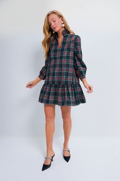 The Highland Tartan Palmerston Dress is the statement style you need for this holiday season! A ruffled stand collar and long sleeves play for a sophisticated feel while the mini length and flirty skirt make us want to party all night long. Stand out at all your holiday events with this good time gal paired with chic heels and a fun bag! Ruffle stand collar Notched neckline Bracelet length sleeves Side pockets Mini length Swing silhouette Lined Material: 100% Polyester, Lining: 97% Polyester, 3% Sundress Season, 50th Clothing, Notched Neckline, Chic Heels, Holiday Events, Cocktail Attire, Spring Trends, Office Fashion, Good Time