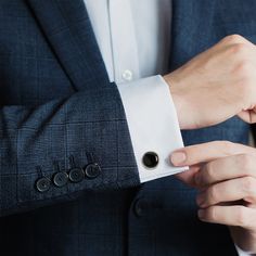 Classic and chic, our Silver and Onyx Cufflinks grant an immediate ensemble boost to your formal wardrobe. Smooth, deep Onyx discs nestle inside silver-finished settings for a simple, classic look suitable for any event. The expert craftsmanship of our base metal cufflinks ensures long-lasting durability. Pairs perfectly with our Onyx Inlaid Tie Clip. Classic Black Business Cufflinks, Elegant Cufflinks For Business, Elegant Black Cufflinks For Business, Black Classic Wedding Cufflinks, Classic Black Wedding Cufflinks, Classic Black Cufflinks For Formal Occasions, Classic Black Formal Cufflinks, Polished Finish Cufflinks For Business, Elegant Cufflinks For Workwear