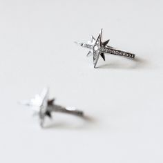 Metal: 925 Sterling Silver Stone: Brilliant cut, Pave brilliant set Stone weight: 0.03 ct (2.0mm) (piece) Total stones weight: 0.14 cttw (piece) Total stones weight: 0.28 cttw (pair) Overall Dimensions: 22mm x 13mm Sterling Silver Star-shaped Diamond Earrings, Silver Star-shaped Diamond Earrings As Gift, Silver Star-shaped Diamond Earrings For Gift, Sterling Silver Star Jewelry With Diamond Accents, Celestial Diamond Silver Earrings, Silver Star-shaped Jewelry With Single Cut Diamonds, Silver Star-shaped Diamond Earrings, Silver Star-shaped Diamond Earrings With Accents, Sterling Silver Star-shaped Jewelry In Diamond White