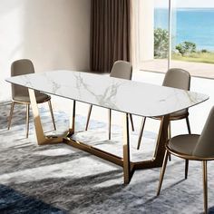 a dining room table with chairs and a large window overlooking the ocean in front of it