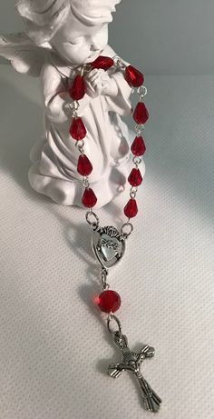 This 5" pocket rosary was created with beautiful red faceted crystal teardrop beads, silver pins, an Immaculate Heart center and a detailed crucifix. Wanna Recreate, Pocket Rosary, Heart Center, Desired Reality, Immaculate Heart, Diy Bracelet Designs, Silver Pin, Teardrop Beads, Diy Bracelet