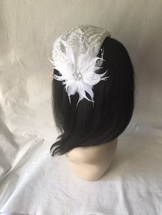 This is a vintage inspired half hat feather flower fascinator ideal for wedding, bridal tea party, mother of the bride, COGIC church hat or any other formal special occasion. Lightweight Can be worn either side Alligator clips underneath or elastic band White Gatsby Style Fascinator For Evening, Vintage White Fascinator For Evening, Vintage White Evening Fascinator, White Vintage Fascinator Hat, Vintage White Fascinator Hat, Vintage White Headpieces For Wedding, Vintage White Wedding Costume Hats And Headpieces, White Vintage Wedding Costume Hats And Headpieces, Vintage White Headpieces For Evening