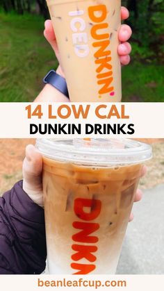 a person holding up a drink with the words dunkin'donuts on it