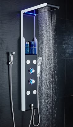 the shower head is open with water coming from it and blue lights shining on the side