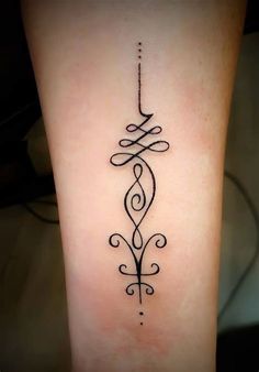 a black and white tattoo design on the leg