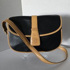 Celine Black And Tan Leather Crossbody Bag Width: 9.44" Height: 7.08" Depth: 1.57" Shoulder/Handle: 40.94" - 44.88" Color: Black Material: Leather Country Of Manufacture: Italy Code, Number: M05 Comes With Nothing, Just Bag As Seen Code Number, Vintage Handbag, Celine Bags, Vintage Handbags, Black Tan, Black And Tan, Leather Crossbody Bag, Tan Leather, Leather Crossbody