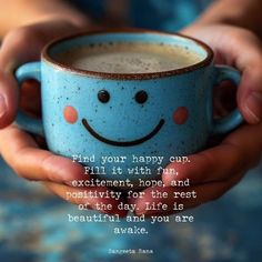 a person holding a cup with a smiley face on it and the words find your happy cup fill it with fun, excitement, hope and positivity for the rest of that day life is beautiful and you are