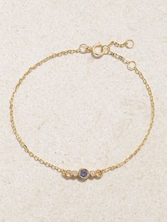 STONE AND STRAND's bracelet is centered with a rose-cut blue sapphire - the facets are inspired by the spiral of the namesake flower's petals and give the stone a soft lustrous glow. It's handmade from 14-karat gold and framed by two tiny diamonds, totaling 0.01-carats. Wear it solo or as part of your daily stack. Elegant Sapphire Faceted Bracelets, Yellow Gold Sapphire Jubilee Bracelets, Yellow Gold Sapphire Diamond Bracelet In Fine Jewelry Style, Elegant Blue Diamond Bracelet In 14k Gold, Yellow Gold Sapphire Diamond Bracelet, Sapphire Diamond Bracelet For Gift, Gold Sapphire Jubilee Bracelet, Elegant Gold Sapphire Bracelets, Yellow Gold Sapphire Bracelet