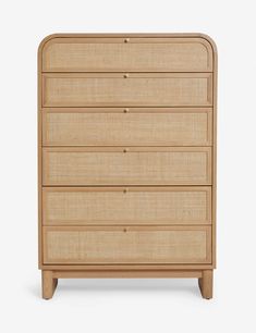 the chest of drawers is made out of wood and has four drawers, one with two handles