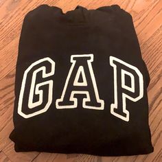 Girls Large Gap Black Hoodie Gap Sweatshirt With Letter Print For Streetwear, Gap Hoodie With Letter Print For Fall, Gap Cotton Crew Neck Hoodie, Gap Hoodie With Letter Print For Streetwear, Gap Crew Neck Hoodie For Streetwear, Gap Streetwear Crew Neck Hoodie, Trendy Black Tops From Gap, Gap Hoodie With Letter Print For Winter, Gap Winter Hoodie With Letter Print