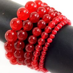 ✦Gemstone: Jade, color dyed ✦Color: Red ✦Shape: Smooth Round Beads ✦Size: 4mm, 6mm, 8mm, 10mm, 12mm ✦Average Strand Weight: < 4oz ✦QTY: 1 pc / package ♕Beautiful & High Quality Bracelet♕  Our bracelet length 7.5", fit with a 6.75" wrist, it is our standard size. We offer to resize bracelet 5"-8" to fit your wrist! If you like the different bracelet lengths, please let us know your wrist size. We are happy to take care of it for you. You can see our Personalization Option. Thank you! MEASURE YOUR WRIST:    - Measure around at the wrist bone in tape or even a strip of paper.   - Choose a place where you would normally wear a bracelet.  Make it as loose or snug.   - To use the strip of paper, mark where the end of the bracelet needs to be and then measure the paper with a ruler.   - Increase Red Jade Bracelet, Jade Color, Red Jade, Jade Bracelet, Pretty Bracelets, Coral Beads, Bridal Party Gifts, Gemstone Healing, Last Minute Gifts