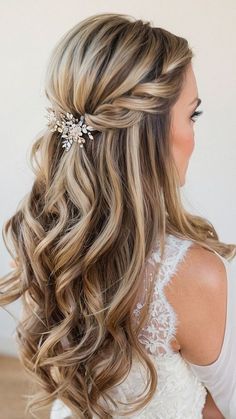 a woman with long hair wearing a wedding hairstyle