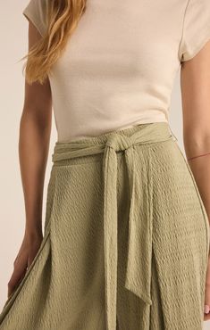 Take your casual look to the next level with the elevated, wide leg Isla Pucker Knit Pant. This pull on style features flattering details that will make this a pant you reach for on repeat. Casual Wide Leg Pants With Tie Waist, Spring Solid Wide Leg Pants With Tie Waist, Effortless Stretch Bottoms For Spring, Versatile Solid Bottoms With Tie Waist, Chic Rayon Bottoms With Tie Waist, Chic Tie Waist Rayon Bottoms, Chic Viscose Bottoms For Spring, Chic High Waist Viscose Bottoms, Spring Stretch Viscose Wide Leg Pants