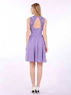 a woman in a short purple dress with open back and lace detailing on the shoulders