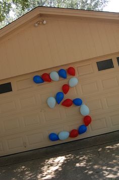 an image of a house decorated with balloons