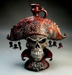 a skull wearing a pirate hat with bells