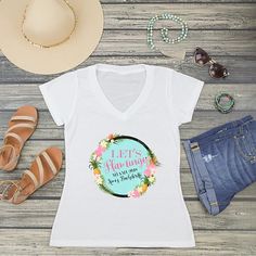 a women's white v - neck shirt with the words let's flamingo on it