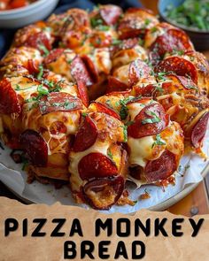 the pizza monkey bread is ready to be cut into pieces and served on a plate