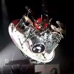 a drum kit sitting on top of a stage