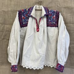 beautiful handmade 1970s traditional folk Romanian blouse with detailed embroidery  made in ARAD Transylvania , Romania  hemp traditionally mens blouse but can also be for a woman. size M / L Each item is special and unique so may have beautiful little imperfections :) message me if you have any questions xx Traditional Long Sleeve Blouse With Woven Motifs, Folk Style Embroidered Peasant Top For Festivals, Folk Style Multicolor Embroidered Peasant Top For Festivals, Folk Style Peasant Top With Embroidered Sleeves For Festival, Folk Style Peasant Top With Multicolor Embroidery For Festival, Spring Folk Blouse With Woven Motifs, Traditional Peasant Top With Floral Embroidery For Fall, Traditional Fall Peasant Top With Floral Embroidery, Bohemian Long Sleeve Blouse With Woven Motifs