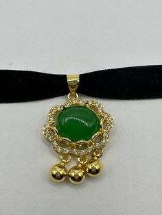 "Vintage Green Jade Choker Gold Finish necklace pendant All green Jade set in an ornate setting golden bronze frame. about 1 in long All jewelry is shipped in a nice gift box.   Check out our over a THOUSAND great reviews This is \"fun jade\" Color enhanced stone. Vintage 1970's re finished." Green Round Locket Necklace, Gold Jade Necklace Gift, Gold Jade Pendant Necklace, Formal Gold Jade Necklaces, Formal Gold Jade Necklace, Gold Jade Round Pendant Necklace, Green Locket Necklace With Round Pendant, Gold Jade Necklace With Round Pendant, Vintage Gold Necklace With Emerald