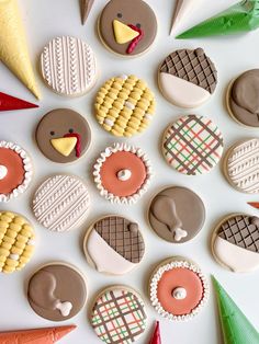 decorated cookies are arranged in the shape of turkeys and other foods on a white surface