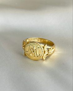 The Marie Antoinette Ring her monogrammed rIng MA, she was the queen of France brfore the French Revolution. This beautiful ring made of 18k gold plated silver and inscribed inside Eat Cake. Elegant 14k Gold Engraved Initials Ring, Elegant 14k Gold Initial Ring With Engraving Option, Timeless Gold-plated Signet Ring, Gold Plated Timeless Signet Ring, Classic Promise Initial Ring With Round Band, Timeless Gold Signet Ring For Promise, Classic Initial Promise Ring, Luxury Gold Engraved Ring, Gold Oval Initial Ring Stamped 14k