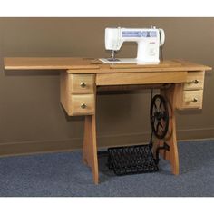 a sewing machine sitting on top of a wooden table