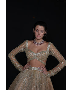 Light Gold Lehenga Set - Bora Honey's Indulge in the allure of our bespoke Champagne Gold Lehenga, a regal ensemble meticulously crafted over 60-90 days. The combination of luxurious tulle and satin creates a breathtaking silhouette, while the Choli Blouse accentuates modern elegance with a touch of tradition. Embellished with stones, crystals, sequins, and Japanese cut-dana, this Lehenga is a shimmering masterpiece that captures the essence of timeless opulence. Every element is thoughtfully pl Golden Blouse Designs, Wedding Bride Dress, Golden Blouse, Gold Lehenga, Hand Embroidery Work, Indian Wedding Bride, Choli Blouse, Indian Bridal Lehenga, Haldi Ceremony