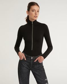 Meet the newest edition to our Everyday | Anywhere wardrobe. Whether you layer yours under a blazer or wear it as is with denim, our Zip Front Bodysuit is an elevated update to your everyday bodysuit. Mock Neck Exposed Zip Front Closure Slim Fit Thong bottom with snap button closure 67% Rayon, 28% Nylon, 5% Spandex Model is 5’10” and wearing a size S. This style runs true to size. We would recommend taking your regular size. Fitted Casual Bodysuit For Layering, Spring Stretch Bodysuit For Layering, Casual Fitted Bodysuit With Zipper, Chic Fitted Bodysuit For Layering, Trendy Fitted Bodysuit For Work, Fitted Bodysuit With Invisible Zipper, Fall Bodysuit For Workwear, Trendy Bodysuit For Workwear, Trendy Stretch Bodysuit For Workwear