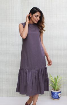 "Features: ● Linen Smocked Layer Dress Length 47\" ● Boat neck ● Sleeveless ● Asymmetric Hem ● Pockets ● Made to Order Description: ● Medium Weight ● Breathable and washed ● Comfortable and Soft Fabric ● Not See Through ● Finished with French Seam  ★★ Welcome to New2Style ★★  Visit my shop  https://www.etsy.com/shop/New2Style  All pieces are made to order, if you have some specific requirements like  ● Change in length of outfit (up to 3\"-4\") or Sleeve length ● Change in style of sleeves or co Summer Dress Linen, Boho Womens Clothing, Linen Summer Dress, Organic Dress, Midi Dress With Pockets, Linen Tunic Dress, Linen Dress Women, Long Linen Dress, Plus Size Summer Outfit