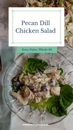 chicken salad with lettuce and tomatoes on a glass plate