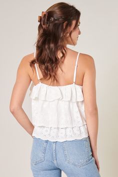 Ruffle some feathers in this adorabel crop top! This eyelet top has spaghetti straps, a square neckline, and adorable ruffles. Pair it with your favorite denim for a perfectly flirty look.- All over eyelet fabric- Tiered ruffled detail- Cropped length- Spaghetti straps- Color: WhiteSize + Fit - Model is 5'8" and wearing size S - Measurements taken from size S - Chest: 33 1/2"- Length from neckline: 12 1/2" Fabric Self: 95% Polyester, 5% Spandex, Trim: 100% Cotton Style Number STT15680 White Casual Camisole With Ruffled Straps, Casual White Camisole With Ruffled Straps, Trendy Ruffled Spaghetti Strap Camisole, Spring Crop Top With Spaghetti Straps And Ruffles, Casual Ruffled Camisole Crop Top, Spring Lace Trim Cropped Camisole, Lace Trim Cropped Top For Day Out, Spring Ruffle Cami Crop Top, Spring Ruffled Cami Crop Top