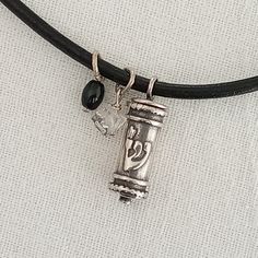 "Jewish symbol jewelry. Mezuzah necklace. Sterling silver. Judaica jewelry gift. Daddy gift. Holyland gift for him. Jewish father gift. A lovely gift Components: # Mezuzah Sterling silver 925 handcrafted dimensions 21 mm # Clear natural quartz # Black rice obsidian # Black leather 5 mm # Sterling silver clasp and findings  This necklace measures 18\" inches in length in this picture You can choose your length I include always a free surprise gift with every order All items are wrapped individual Hanukkah Gift Pendant Jewelry, Spiritual Jewelry For Hanukkah Gift, Sterling Silver Jewelry For Hanukkah Gifts, Mezuzah Necklace, Jewish Symbol, Symbol Jewelry, Jewish Symbols, Judaica Jewelry, Black Rice