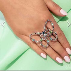 Dotted In Iridescent And Colorful Rhinestones, An Oversized Silver Butterfly Flutters Atop Airy Silver Bands, Resulting In A Dazzling Statement Piece. Features A Stretchy Band For A Flexible Fit. Due To Its Prismatic Palette, Color May Vary. Bundle Several Items & Save Packaged Well No Worries! Smoke Free Home *Poshmark Fee Included In Price. #New #Paparazzi #Jewelry #Blinglife Party Jewelry With Rhinestones In Butterfly Shape, Party Jewelry With Rhinestones And Butterfly Shape, Butterfly Shaped Party Jewelry With Rhinestones, Butterfly-shaped Party Jewelry With Rhinestones, Butterfly-shaped Rhinestone Party Jewelry, Elegant Butterfly Ring For Parties, Elegant Silver Butterfly Ring For Party, Blue Butterfly Jewelry For Party, Silver Bands