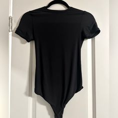 Brand New And Never Worn ! Super Sleek And Smooth, Very Lightweight Black Short Sleeve Bodysuit For Night Out, Casual Black Short Sleeve Bodysuit For Night Out, Black Short Sleeve Bodysuit For Summer Night Out, Basic Black Stretch Short Sleeve Bodysuit, Black Short Sleeve Basic Bodysuit, Basic Black Short Sleeve Bodysuit, Basic Black Bodysuit For Summer, Basic Black Summer Bodysuit, Black Bodysuit