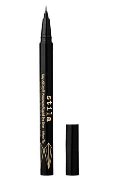 What it is: A limited-edition liquid eyeliner that adds precision color definition to any look.What it does: From captivating dark green and grey to mesmerizing, shimmering graphite and garnet, Stila's limited-edition collection of metal liquid eyeliners adds precision color definition to any look. The ultrafine delicate felt-tip applicator lays down a superfine dose of pigment to allow for the most intricate graphic designs. The waterproof and transfer-proof formula glides on smoothly and dries Dark Green And Grey, Color Definition, Liquid Eyeliner Pen, Felt Tip, Eyeliner Pen, Iron Oxide, Kids Branding, Liquid Eyeliner, Graphic Designs