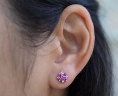 The diameter of the earrings is approximately 1/4 inch. It consists of 10 pink sapphires totaling about 0.69ct. and 8 diamonds totaling about 0.11ct. It is all set in 18K white gold. The color of the pink sapphires ranges from medium pink to dark pink under different lighting. Please visit our shop policies for more details. For more information, Like us on Facebook, follow us on Instagram or visit our website www.ikedapearl.com If you have any questions or inquiries, please don't hesitate to co Pink Diamond Earrings With Diamond Accents As Gift, Pink Diamond Earrings With Accents, Pink Diamond Earrings For A Gift, Pink Diamond Earrings As Gift, Pink Diamond Earrings Gift, Gift Pink Diamond Earrings With Accents, Pink Brilliant Cut Diamond Earrings, Pink Diamond Earrings With Prong Setting For Anniversary, Pink Diamond Gemstone Earrings For Anniversary