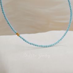 Super tiny natural baby blue turquoise beaded necklace in 18K solid gold. Made to Order Ship within 3-4 weeks. - Stone info: natural 3mm turquoise - Finish: Yellow - Length: 17.75" - Made in 18 karat gold. - Stamp with 18K. Blue Turquoise Necklace With Tiny Beads For Gift, Minimalist Blue Beaded Turquoise Necklace, Yellow Gold Turquoise Necklace With Round Beads As Gift, Elegant Blue Turquoise Necklace With Tiny Beads, Dainty Blue Turquoise Necklace With Tiny Beads, Dainty Turquoise Necklace With Tiny Beads As Gift, Minimalist Turquoise Necklace With Tiny Beads, Turquoise Beaded Necklace, Turquoise Bead Necklaces