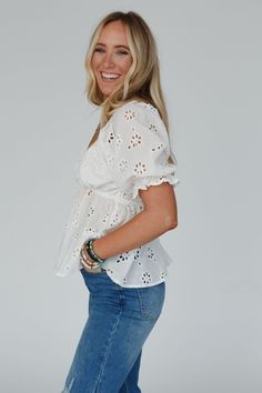 Elevate your style with the timeless and charming, Let Love Embroidered Top with details that add a touch of romance to your everyday looks! Whether dressed up or down you're going to love this unique top because it features: So pretty and unique Cotton fabric with floral eyelet details throughout Flattering deep v - neckline with cute gathered fabric details Cute short puff sleeves with elastic sleeve closures Pointed gathered babydoll - style center seam Lined along the bust for added coverage Cute Fitted Tops For Brunch, Embroidered V-neck Top For Day Out, White Puff Sleeve Top With Floral Embroidery, Fitted Embroidered Tops With Puff Sleeves, Fitted Short Sleeve Top With Broderie Anglaise, Fitted Tops With Broderie Anglaise For Day Out, Fitted Broderie Anglaise Short Sleeve Top, Trendy Embroidered Tops For Day Out, Feminine Embroidered White Tops