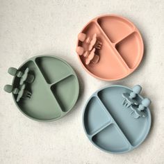 three plastic plates with different shapes and sizes