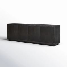 a black cabinet sitting on top of a white floor