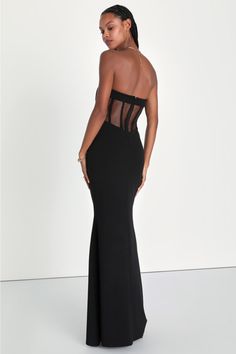 Heads are sure to turn when you walk in wearing the Lulus Iconic Arrival Black Strapless Bustier Mermaid Maxi Dress! Stretchy, crepe-knit fabric shapes this dramatic dress that has a bustier-inspired bodice with hidden supportive boning and no-slip strips. Pleated details decorate the front, while the back boasts sheer mesh panels for an eye-catching accent. Fitted waist tops a figure-skimming mermaid skirt that finishes at a maxi hem. Hidden zipper/clasp at back. Fit: This garment fits true to Fitted Strapless Corset Dress For Gala, Fitted Evening Corset Dress With Boning, Elegant Strapless Dress With Sweetheart Neckline And Boning, Fitted Maxi Length Corset Dress With Corset Back, Backless Strapless Dress With Fitted Bodice For Gala, Fitted Strapless Dress With Boned Bodice For Cocktail, Strapless Fitted Bodice Backless Dress For Gala, Chic Strapless Elastane Party Dress, Fitted Bodice Bandage Dress For Gala