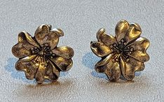 "Vintage 1940s era fine Sterling Silver flower earrings. Earrings are nicely detailed and are screw back style. Earrings are fully hallmarked and will arrive gift boxed. HALLMARKS BGE, 925. MEASUREMENTS 1/2\" across. WEIGHT 3.93 GRAMS. MATERIALS Sterling Silver." Vintage Sterling Silver Clip-on Earrings, Vintage Flower-shaped Pierced Earrings, Vintage Flower-shaped Earrings For Anniversary, Vintage Flower Shaped Earrings, Vintage Nickel-free Clip-on Earrings For Anniversary, Vintage Flower-shaped Clip-on Earrings, Vintage Flower Shaped Clip-on Earrings, Vintage Silver Flower-shaped Earrings, Vintage Nickel-free Flower Earrings